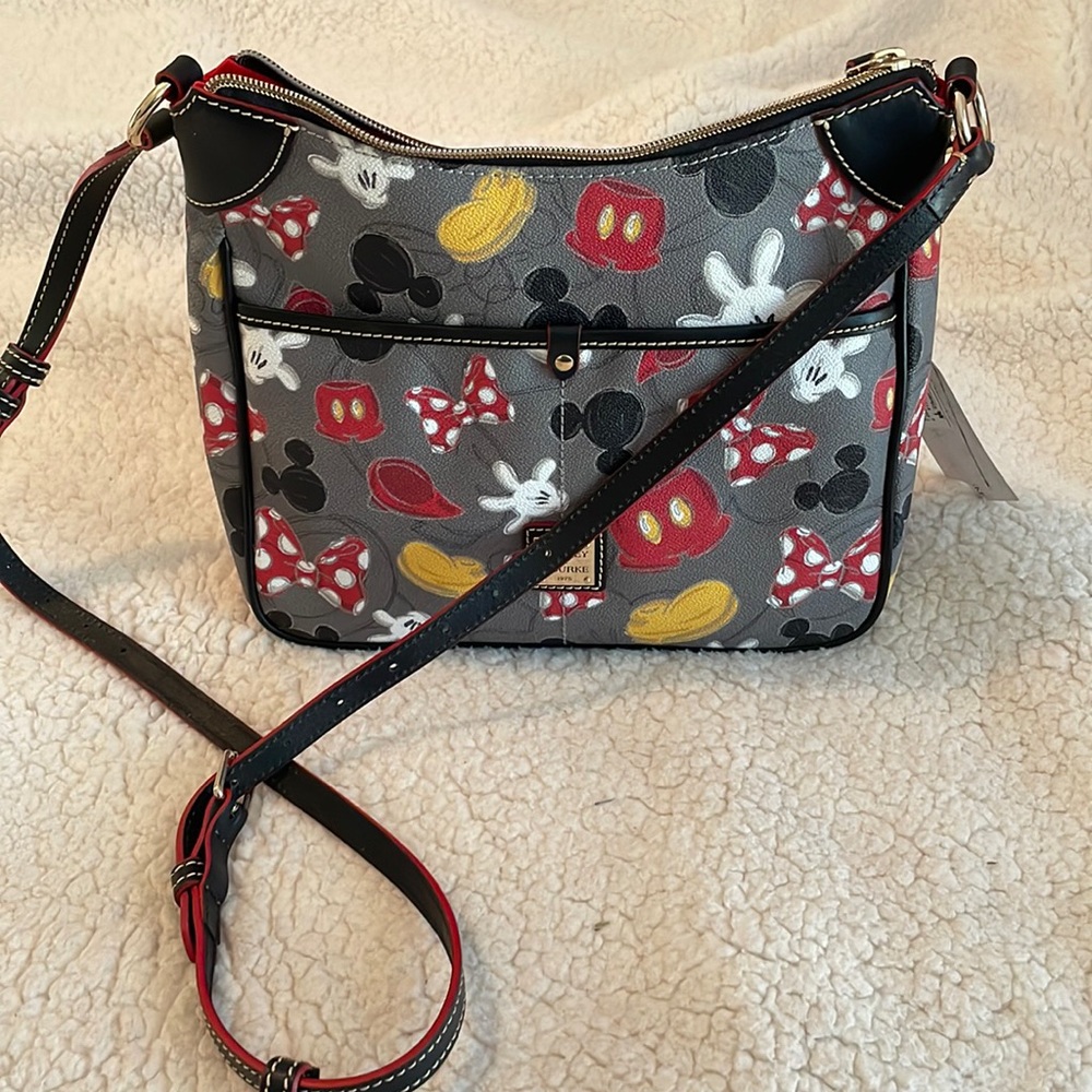Disney Dooney & Bourke. Brand new with tags.  Mickey Pieces print.